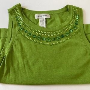 Pretty sweater with unique beaded detail. Use alone or under your blazer.